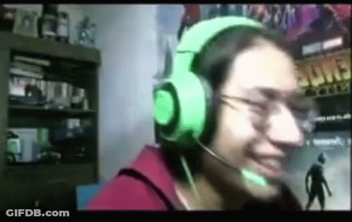 Person Wearing Green Headphones Smiling Into Microphone GIF
