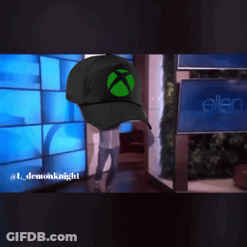 Person Wearing Green Xbox Hat Walking GIF