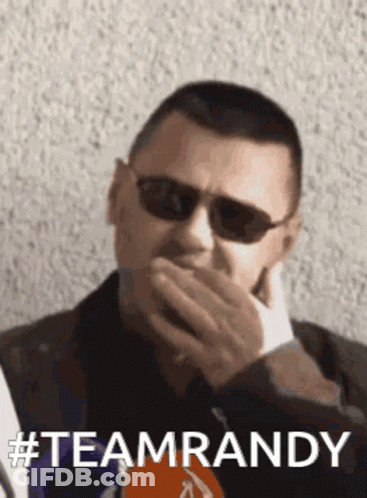 Person Wearing Hat And Goggles In Front Of Tokyo Major Poster GIF