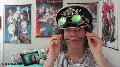 Person Wearing Hat And Goggles In Front Of Tokyo Major Poster GIF