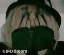 Person Wearing Hat And Sunglasses Covering Face GIF