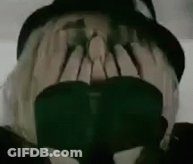 Person Wearing Hat And Sunglasses Covering Face GIF