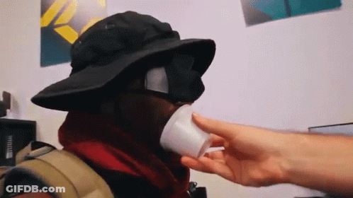 Person Wearing Hat And Sunglasses Drinking GIF