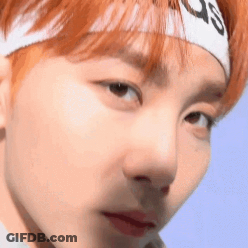 Person Wearing Headband Looking At Camera GIF