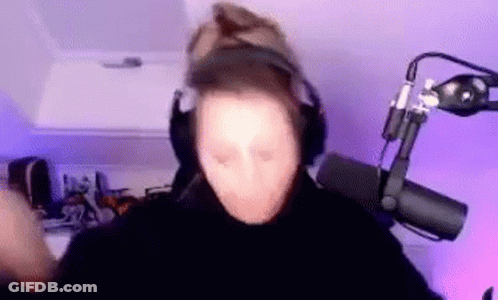 Person Wearing Headphones And Hat Standing In Front Of Microphone GIF