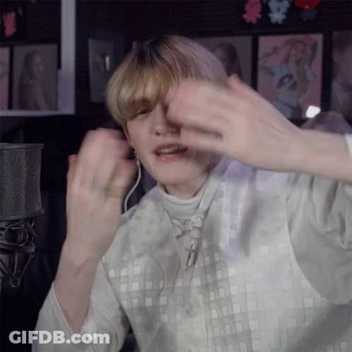 Person Wearing Headphones And White Square Shirt GIF