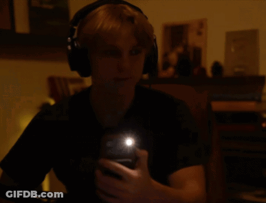 Person Wearing Headphones Taking Selfie GIF