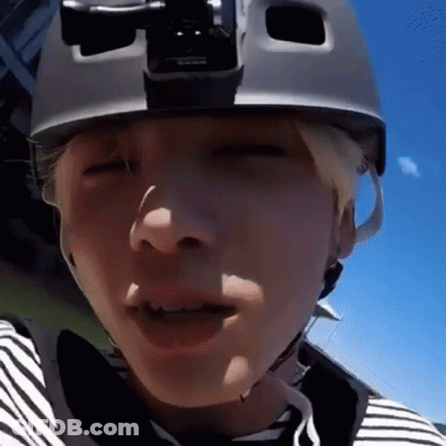 Person Wearing Helmet And Striped Shirt GIF