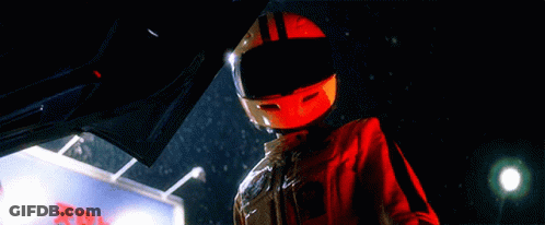 Person Wearing Helmet Next To X Sign GIF