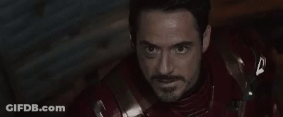 Person Wearing Iron Man Helmet With Blue Eyes GIF