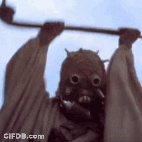 Person Wearing Mask Holding Stick GIF