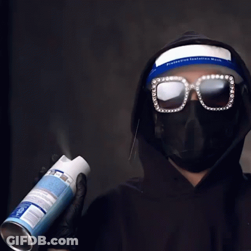 Person Wearing Mask Spraying Can GIF