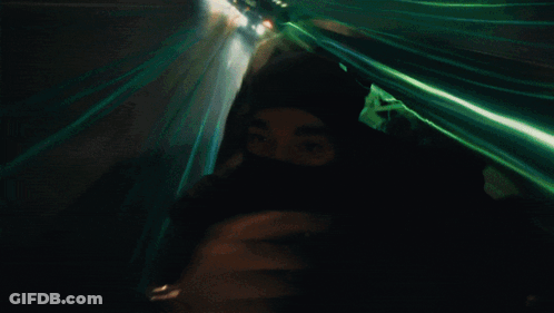 Person Wearing Mask Walking At Night GIF