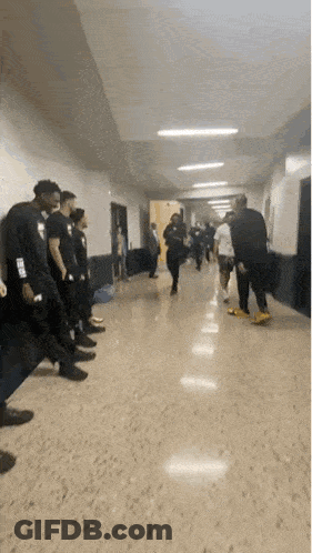 Person Wearing NBA Shirt In Hallway GIF