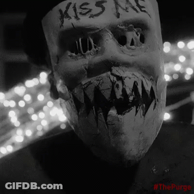 Person Wearing Neon Skull Mask GIF