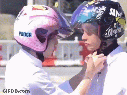 Person Wearing Pink Helmet With Punch GIF