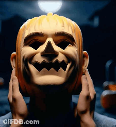 Person Wearing Pumpkin Mask With Smile GIF