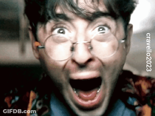 Person Wearing Puppet Mask Riding Bicycle In Hallway GIF