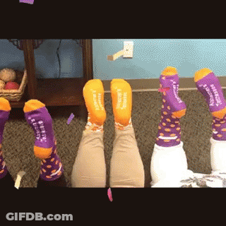 Person Wearing Purple And Orange Socks Saying I Love You GIF