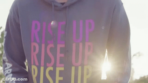 Person Wearing Rise Up Rise Up Hoodie GIF