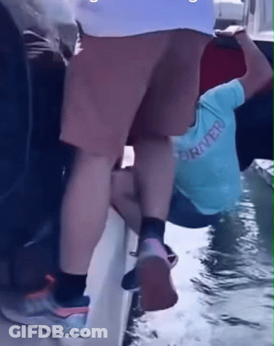 Person Wearing Rover Shirt Climbs Boat GIF