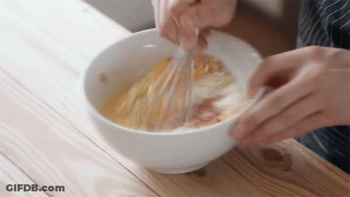 Person Whisking Eggs In White Bowl GIF