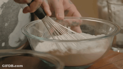Person Whisking Flour In Bowl GIF