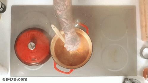 Person With Arm Tattoo Stirring Pot GIF