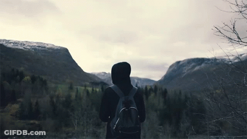 Person With Backpack In Front Of Mountain GIF