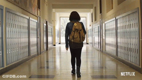 Person With Backpack Walking Down Hallway Netflix GIF