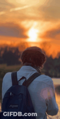 Person With Black Backpack Watching Sunset GIF