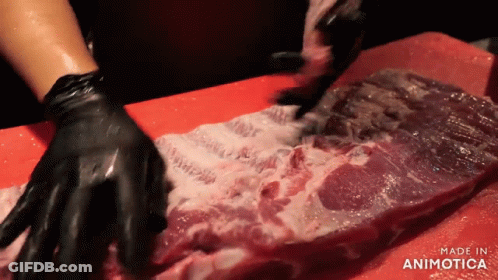Person With Black Gloves Cutting Meat Red Board Made In Animatica GIF