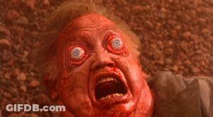 Person With Blood On Face Lying On Ground GIF
