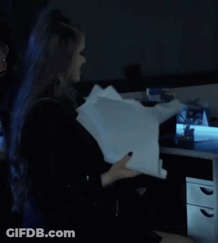 Person With Blue Hair Holding Paper GIF