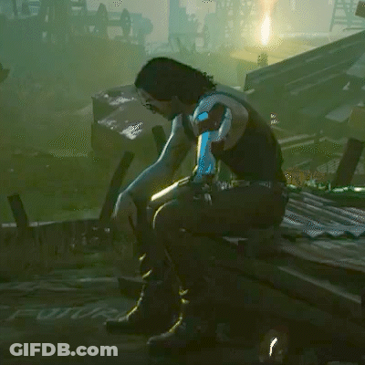 Person With Blue Hair Sitting In Video Game GIF