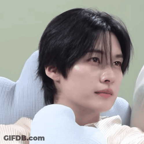 Person With Blue Pillow Around Neck GIF
