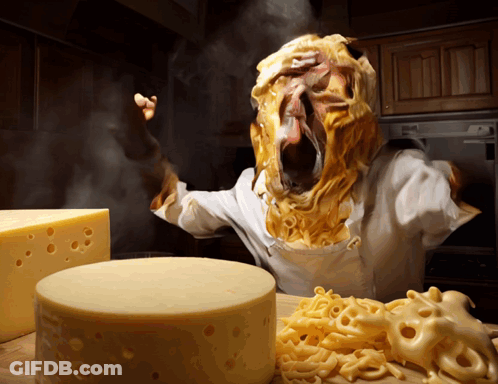 Person With Cheese On Face Next To Cheese Block GIF