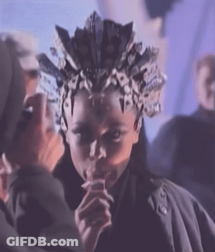 Person With Crown Drinking From Straw GIF