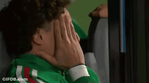 Person With Curly Hair Covering Face With Hand GIF