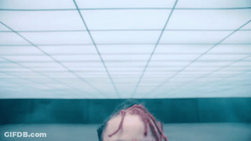 Person With Dreadlocks Looking Up At Ceiling GIF