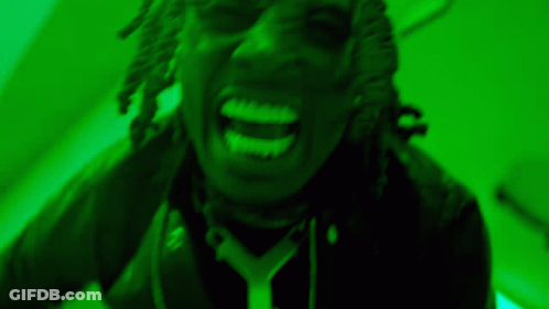Person With Dreadlocks Screaming In Green Light GIF