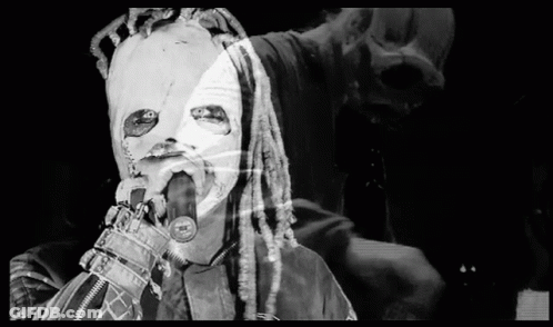 Person With Dreadlocks Singing Into Microphone GIF