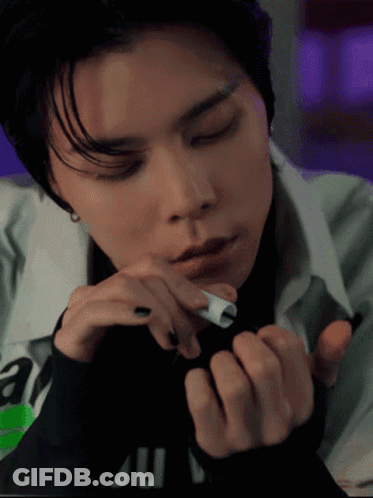 Person With Eyes Closed And Ju On Shirt GIF