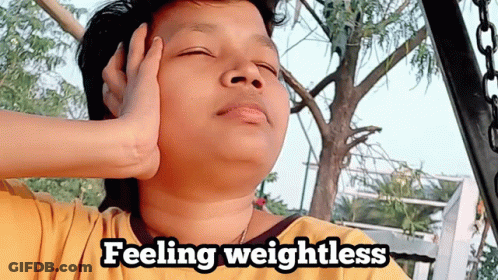 Person With Eyes Closed Feeling Weightless GIF