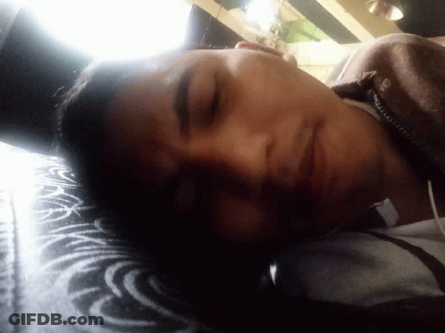 Person With Eyes Closed In Black Shirt GIF