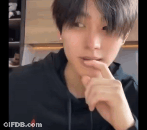 Person With Finger Over Mouth GIF