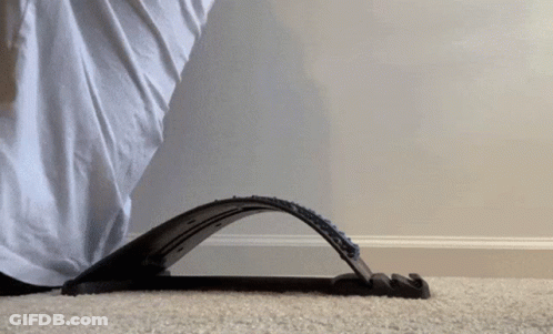 Person With Foot On Device On Carpet GIF