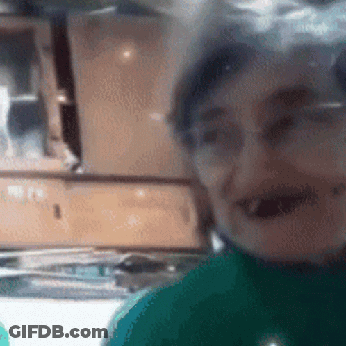Person With Glasses And Green Shirt GIF