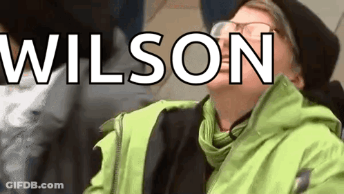 Person With Glasses In Green Jacket Wilson GIF