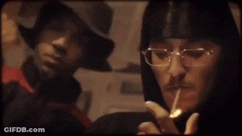 Person With Glasses Smoking Cigarette GIF